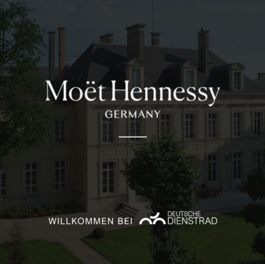 Screenshot eines LinkedIn-Posts von "Deutsche Dienstrad" mit dem Text: "Moët Hennessy fährt mit Deutsche Dienstrad!" und einem Dank an Wiebke Rowedda. Ein Bild darunter zeigt ein Gebäude mit dem Schriftzug "Moët Hennessy Germany" und "Willkommen bei Deutsche Dienstrad."